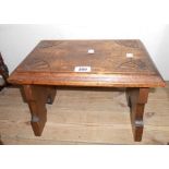 A 15" 19th Century oak low stool with fan carved corners to top, set on decorative standard ends