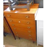 A 25 1/2" retro teak effect chest with flight of six drawers, set on turned and tapered legs -