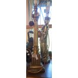 A modern brass Corinthian column table lamp - sold with a plaster table of an oriental figure