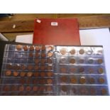 A coin album containing a collection of mostly 21st Century coinage - sold with another similar