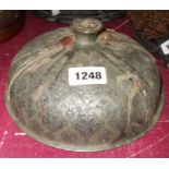 An antique Persian lid as a candlestick