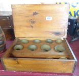 A vintage cased set of small bells and stand (numbered octave)