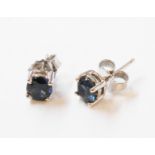 A pair of marked 750 white metal sapphire stud ear-rings - oval stones 5.5mm long