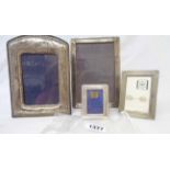 Three hallmarked silver photograph frames including a small frame with 1996 presentation date - sold
