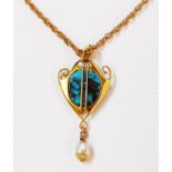 A marked 15ct yellow metal Art Nouveau style pendant, set with natural torquoise panel and blister