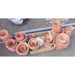 A large quantity of assorted terracotta flower pots