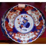 An Imari oval dish and two similar plates