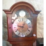 A vintage Elliott of London figured walnut veneered grandmother clock with decorative arched dial