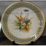 A hand painted Royal Worchester porcelain cabinet plate with floral spray within a jewelled enamel