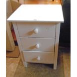 A 17" modern white finish three drawer bedside chest