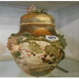 A late Satsuma jar and cover decorated with hand painted applied birds in foliage