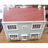 A vintage painted wood doll's house