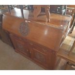 A 4' 19th Century walnut bureau base with carved roundel decoration and fitted interior over two