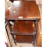 A 20" early 20th Century stained oak three tier table, set on slender barley twist supports