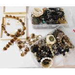 A large quantity of assorted costume jewellery including Monet, tiger's-eye set necklace and