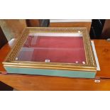 A 28 1/2" part painted wood table top display cabinet with ornate gilt framed glazed top