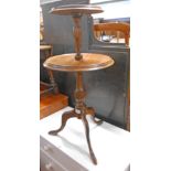 A 19th Century mahogany two tier dumb waiter with reeded turn support, set on tripod base