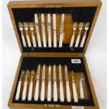 An oak cased part set of silver and mother-of-pearl handled fruit knives and forks, comprising