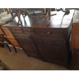 A 4' 1" 19th Century french stained oak sideboard with three frieze drawers and pair of decorative