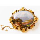 A 2 1/4" antique ornate gilt metal mounted oval brooch with hand painted view of Mont Blanc with