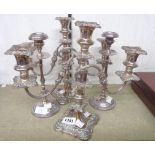 A pair of twin branch three light candelabra with detachable nozzles and stems - sold with a pair of