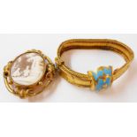 An ornate unmarked yellow metal and blue enamelled belt style bracelet with fractures to tang - sold