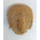 An antique South American pottery mask head
