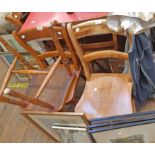 A set of four matching elm seated kitchen chairs stamped HJ - sold with three others - various