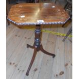 A 17" 19th Century rosewood pedestal wine table with beaded edge to octagonal top, set on ringed