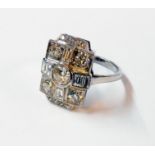 A marked PLAT Art Deco style panel ring, set with five round brilliant cut diamonds interspersed