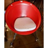 A vintage red moulded composite UFO chair - Atomic age, set on chrome plated tapered legs with