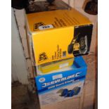 A JCB finishing sander, Silverline bench grinder, box of screws, and a hole saw set