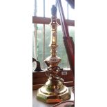 A modern brass candlestick form table lamp