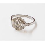 A marked PLAT Art Deco style ring, with central open set diamond within a diamond border with