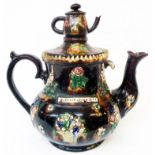 A Victorian Bargeware teapot entitled William Cook 1873 and decorated in the typical style, with