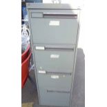 A metal four drawer filing cabinet