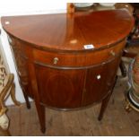 A 30" late 19th Century mahogany, crossbanded and strung demi-lune cabinet with sunray veneer,