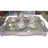 A silver plated copper serpentine gallery tray - sold with a white metal slave bangle dish and other