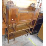 A 3' 7" early 20th Century oak break top bureau unit with fitted interior, flanking cupboards and