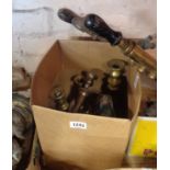 A box of brass candlesticks and other metalwork
