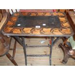 A 24" late Victorian part ebonised folding table with stenciled fine decorated border to top, set on