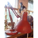 A vintage 1001 Lamps Ltd anglepoise lamp with original red finish