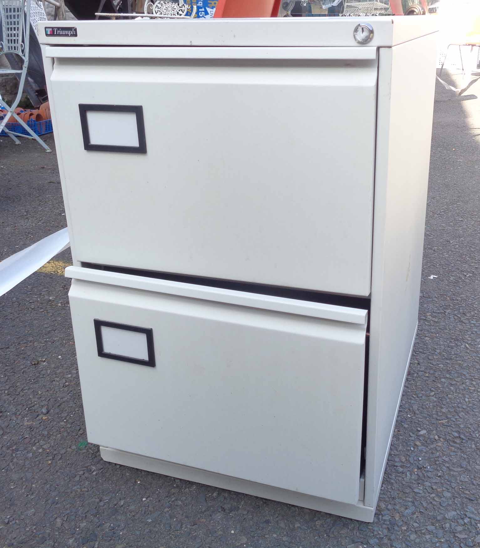 A metal two drawer filing cabinet