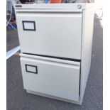 A metal two drawer filing cabinet
