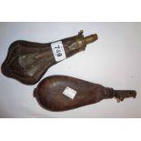 An antique leather shotbag and copper powder flask