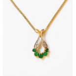 An import marked 375 gold pendant, set with small emeralds and diamonds, on similarly marked 375
