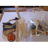 A bag containing assorted collectable items including bone, patches, etc.