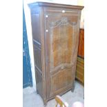 A 34" 19th Century French oak freestanding cupboard with moulded cornice and adjustable shelves