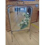 A brass framed mirrored firescreen