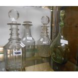 An early 19th Century spirit decanter decorated with engraved swagging and slice cutting, with